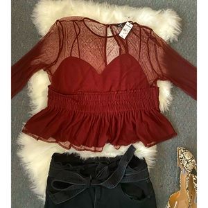 Never worn mesh detail long sleeve peplum blouse